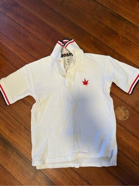 Boast Kids' White Polo with Iconic Red Leaf Logo